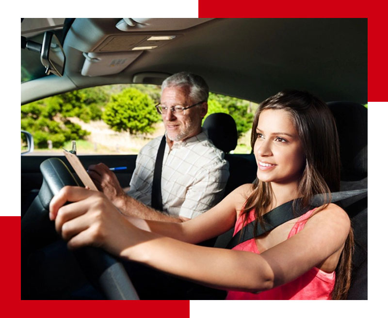 A woman driving in the back of a car while an older man sits behind her.